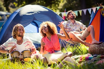 Fototapeta premium Friends having fun together at campsite