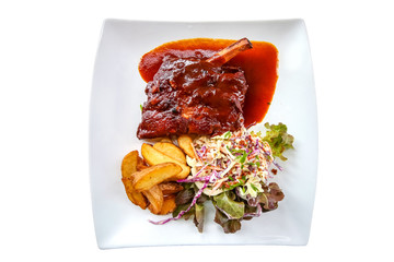 Isolated Closeup grilled pork baby ribs with barbecue sauce