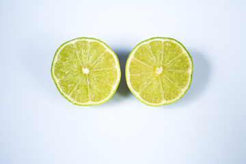 A lime sliced in half isolated on white background