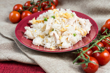 Homemade Chinese fried rice with vegetables and fried eggs