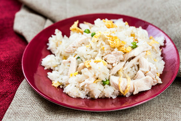 Homemade Chinese fried rice with vegetables and fried eggs
