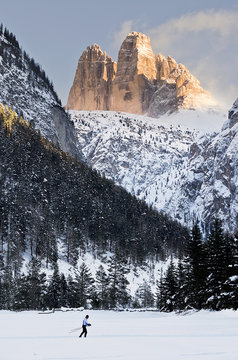 Italy, Trentino Alto Adige, nordic skiing under the Tre cime di Lavaredo at winter sunset.