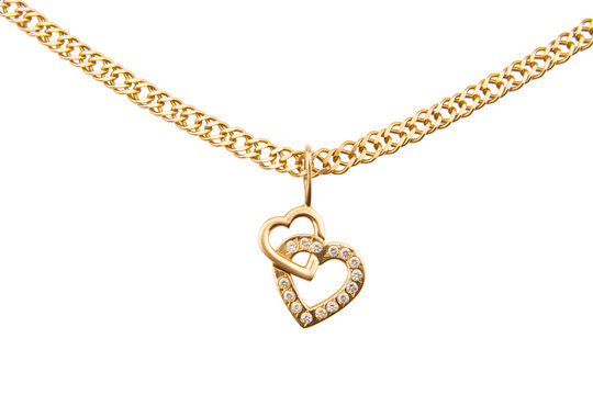 Gold chain and pendant in the shape of heart on a white background