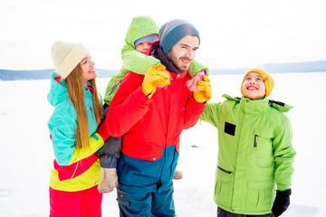 Family on a winter lake