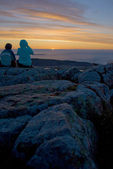 Silhouette of Tourists Watching Sunrise at Cadillac Mountain in Acadia National Park