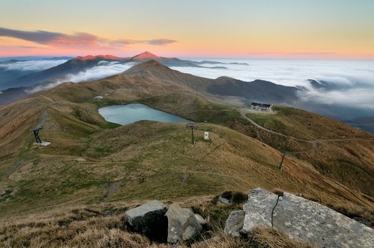 The hot colors of sunrise on the Lake Scaffaiolo in the regional park of Corno alle Scale at the refuge Duca degl'Abruzzi. Emilia Romagna, Italy