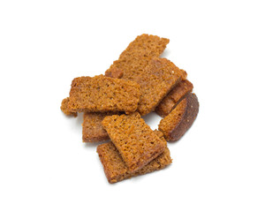 Many small salty dried rusks isolated on white