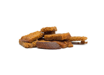 Many small salty dried rusks isolated on white