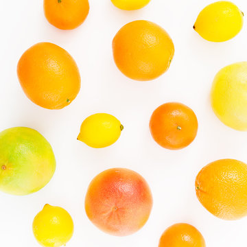 Lemon, orange, mandarin, grapefruit, sweetie and pomelo on white background. Flat lay, top view. Fruit pattern