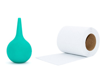Enema and toilet paper isolated on white background