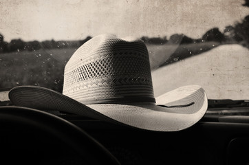 Vintage style straw cowboy hat during country summer. 
