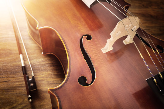 Cello on wood background