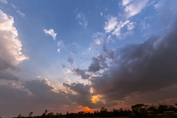 Colorful dramatic sky with cloud at sunset.Sky with sun background.