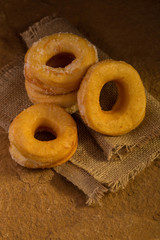 Donuts with sugar on a dark background. Selective focus.