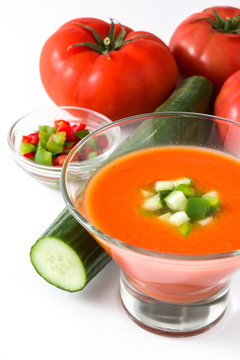 Traditional Spanish cold gazpacho soup and ingredients  isolated on white background
