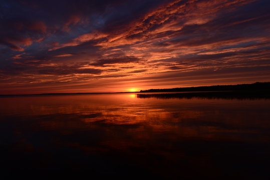 Shadows and sunset light on the surface of the lake water