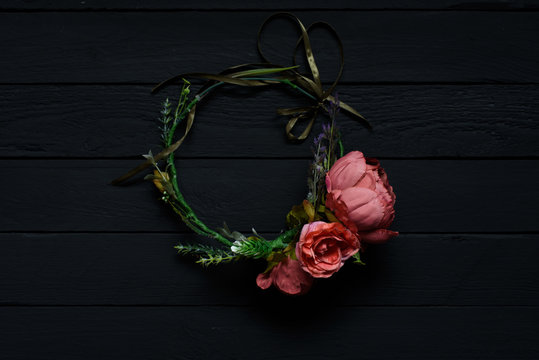 Flower wreath hairpin with flowers isolated on black background