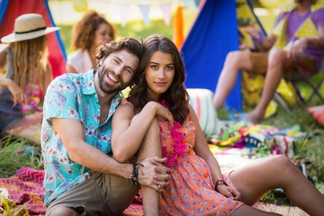 Couple sitting near campsite