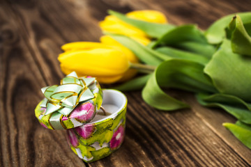 yellow tulips and engagement ring