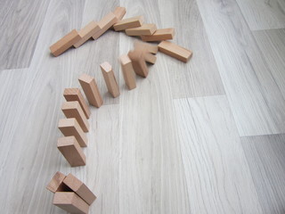 on the wooden floor as a question mark-shaped wooden blocks,
