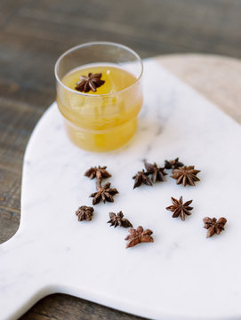 Freshly made drink in glass with star anise 