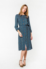 Young elegant female in light summer dress, over white background