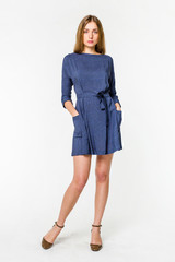 Young elegant female in light summer dress, over white background