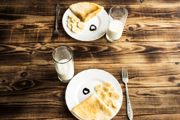 breakfast for two, crepe with banana and milk
