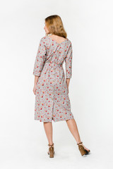 Young elegant female in light summer dress, over white background