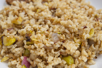 cooked integral rice with vegetables, closeup