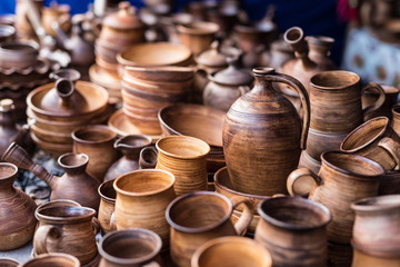 variety of wooden kitchenware on market stall