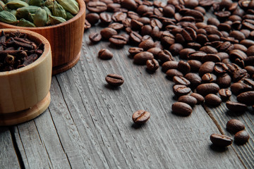 Coffee beans on a wooden background close-up