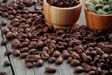 Coffee beans on a wooden background close-up