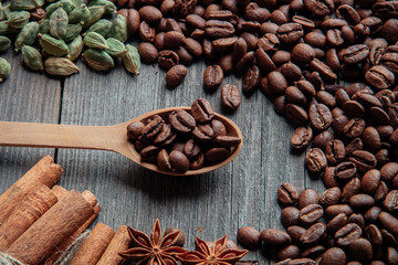 Coffee beans on a wooden background close-up