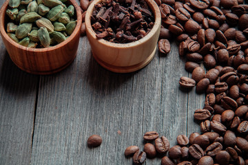 Coffee beans on a wooden background close-up
