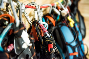 different climbing equipment, carabiners and ropes closeup