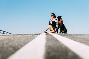 Beautiful young loving her dog.