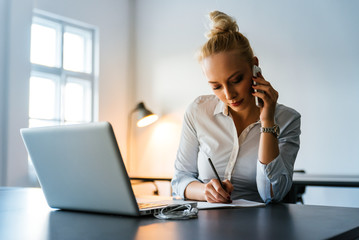 Attractive businesswoman working in an office