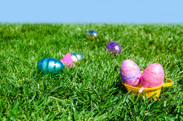Easter eggs on the grass background