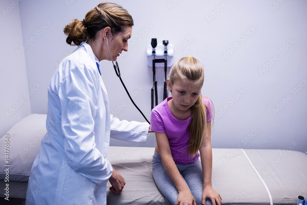 Poster doctor examining a patient with stethoscope