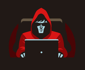 hacker stalker using a computer in the darkness