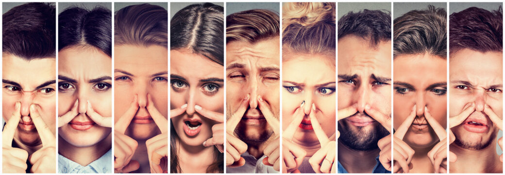 Group of people pinching nose with fingers something stinks bad smell