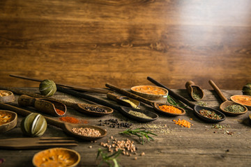 Herbs and spices on wooden table. place for logo