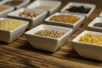 Assortment of legumes, grain and seeds. Various types of grains, rice, legumes spices and herbs