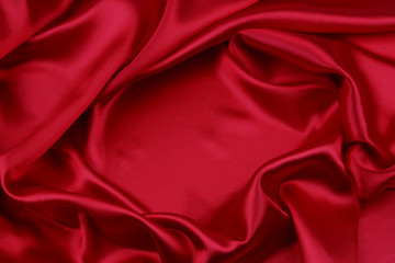 Rippled red silk fabric sheet texture