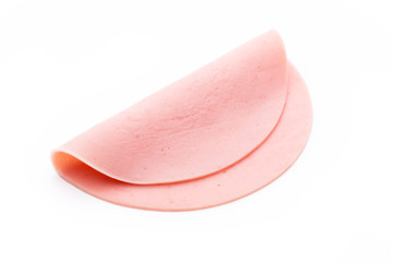 Sliced boiled ham sausage isolated on white background, top view