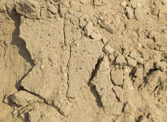 Fototapeta premium Sand, small rocks and cracks - texture