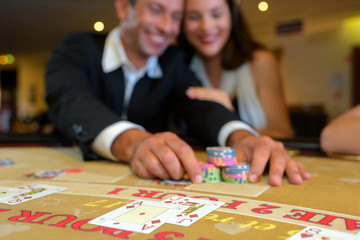 Couple playing at casino table