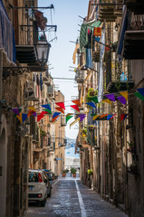Narrow italian street in Cefalu town 