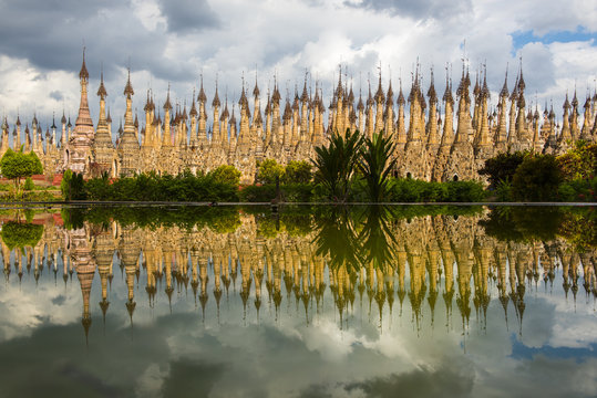 Exterior view of Kakku Pagodas reflecting in water